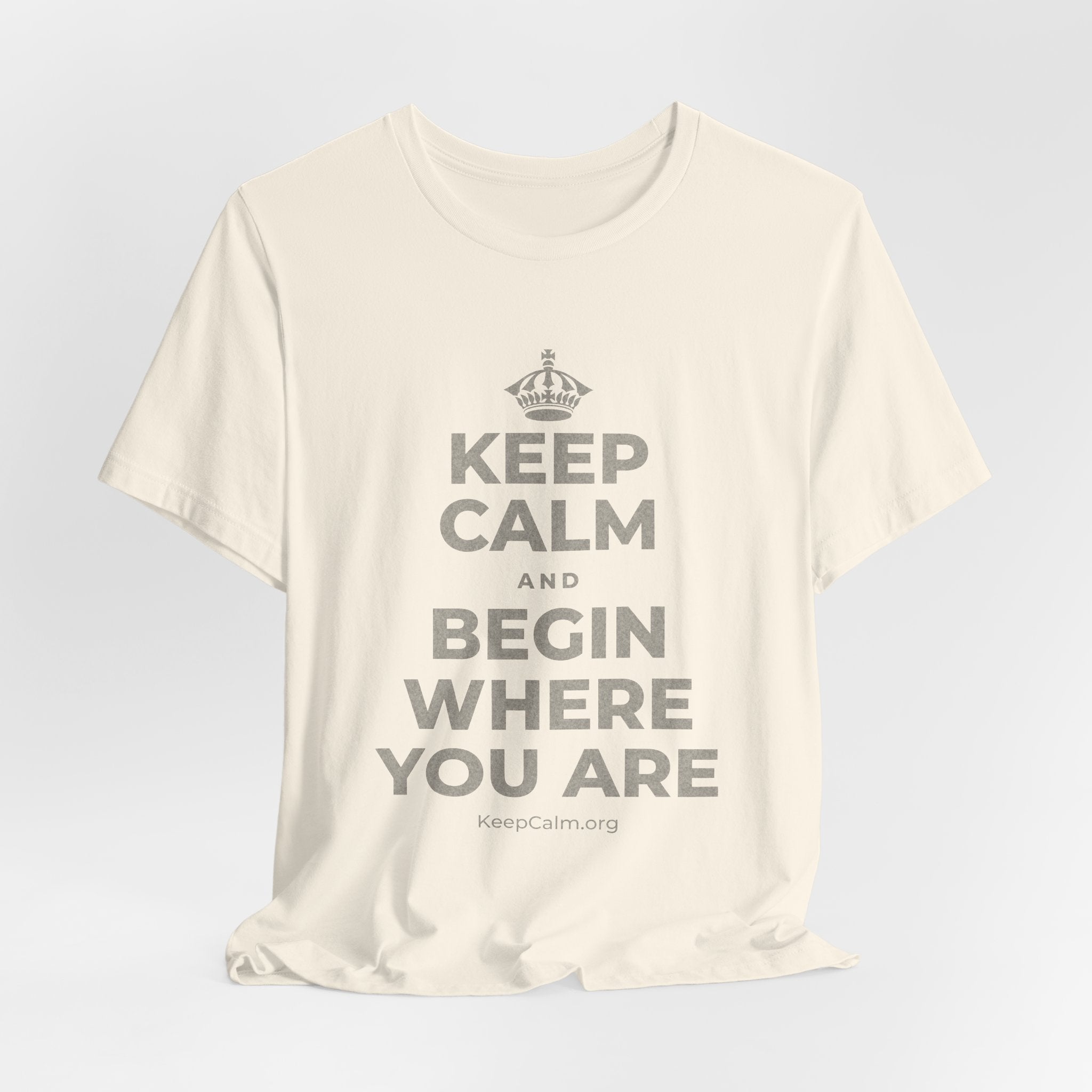 KEEP CALM AND BEGIN WHERE YOU ARE T-Shirt (White–Asphalt)